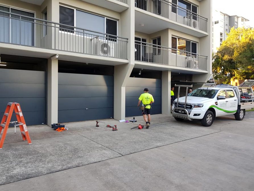 ten tilt garage doors installed at an apartment complex in Caloundra, Sunshine Coast.